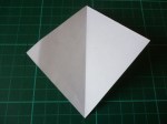 18. Have the white side facing up, and fold from one corner to the other